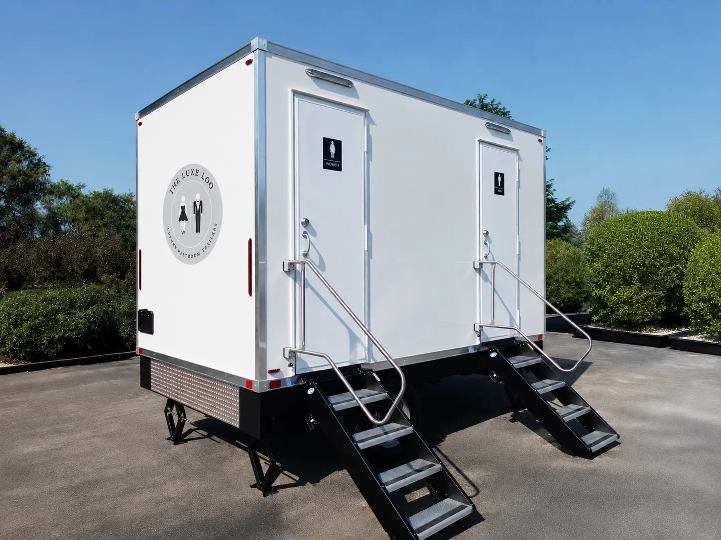 Luxury restroom trailer exterior with dual entrances and stairs